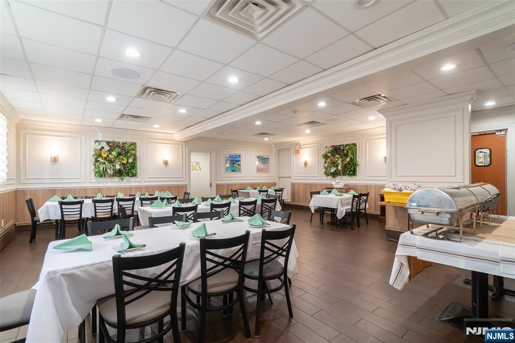 72-74 Elm Road Newark, NJ 07105 - Photo 19 of 41 a group of people sitting at tables in a room