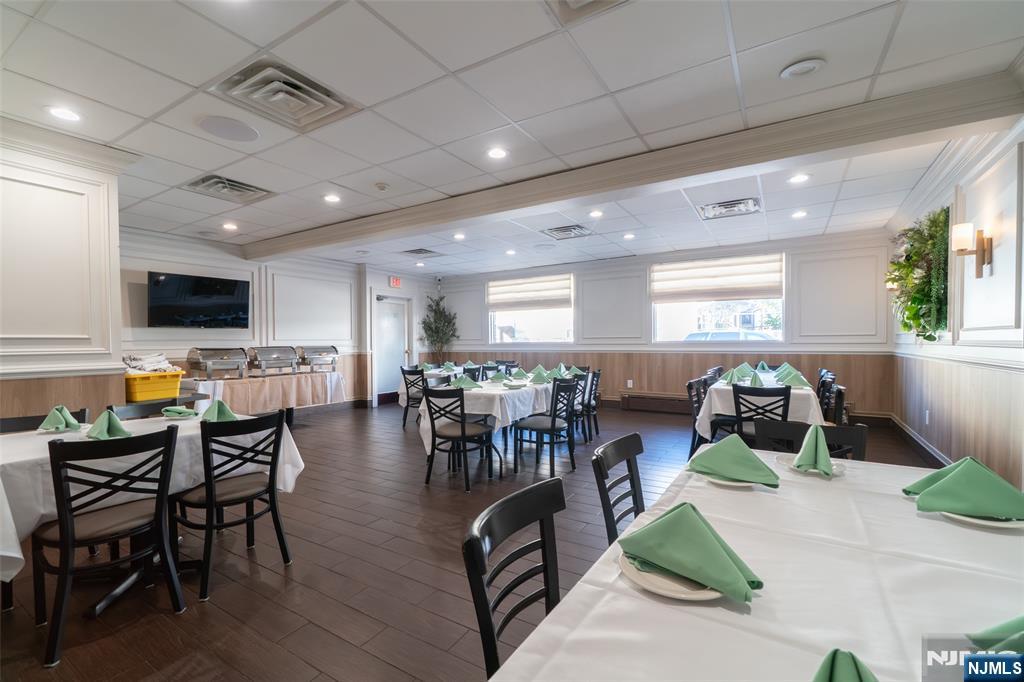 72-74 Elm Road Newark, NJ 07105 - Photo 20 of 41 a living room with lots of furniture kitchen view and a large window
