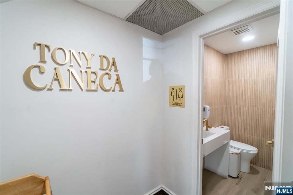 72-74 Elm Road Newark, NJ 07105 - Photo 21 of 41 a bathroom with a toilet and a shower