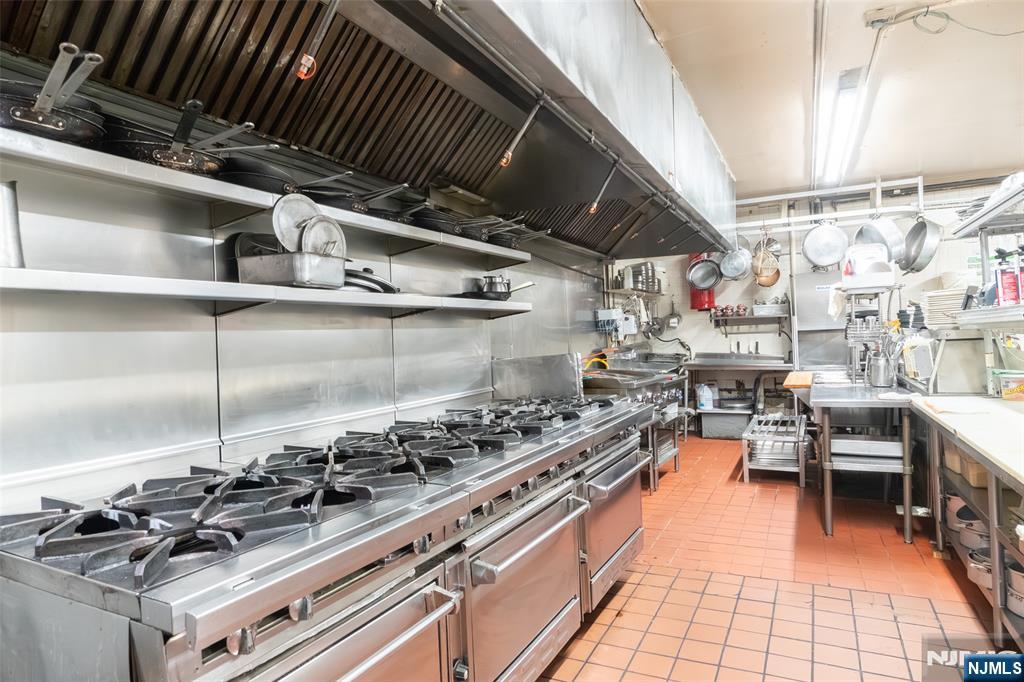 72-74 Elm Road Newark, NJ 07105 - Photo 23 of 41 a kitchen with lots of appliances