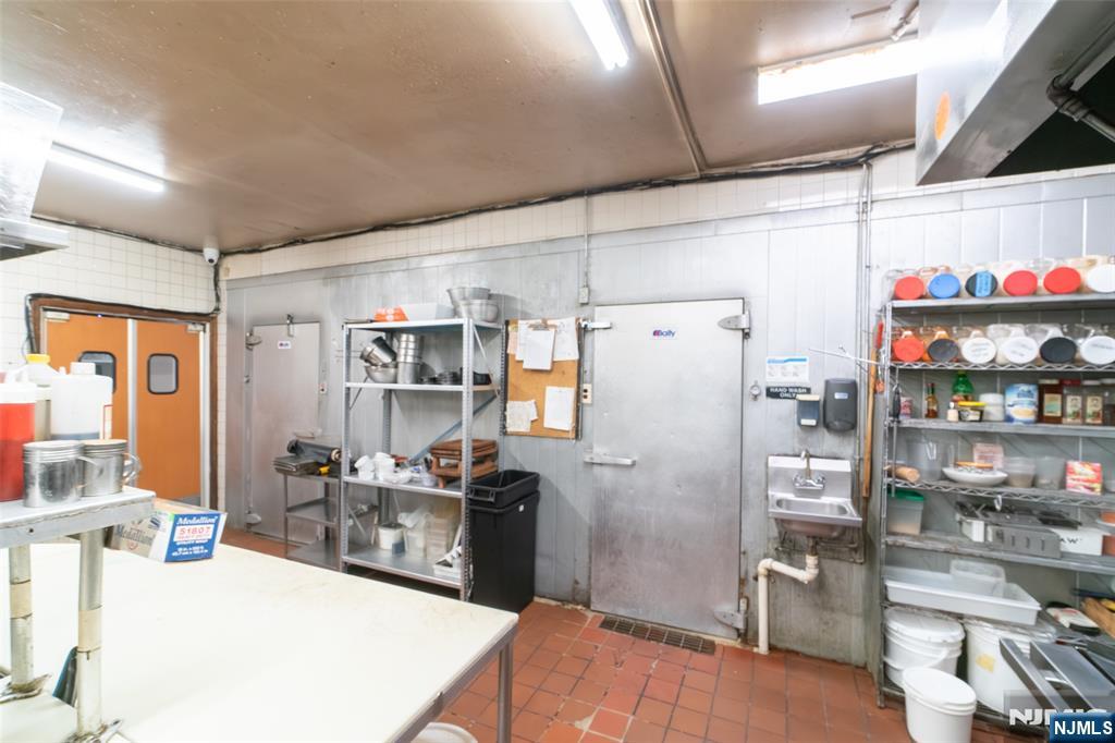 72-74 Elm Road Newark, NJ 07105 - Photo 26 of 41 a kitchen with refrigerator and window