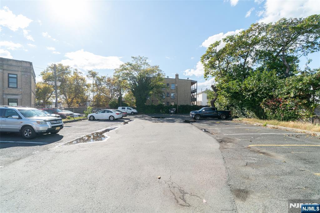 72-74 Elm Road Newark, NJ 07105 - Photo 4 of 41 a view of car parked on the side of a street