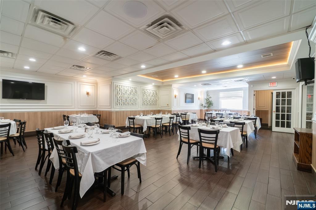 72-74 Elm Road Newark, NJ 07105 - Photo 5 of 41 a view of a dining area with furniture window and wooden floor