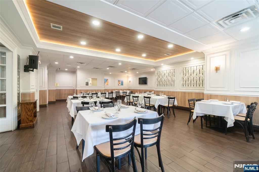 72-74 Elm Road Newark, NJ 07105 - Photo 6 of 41 a view of a dining area with furniture and wooden floor