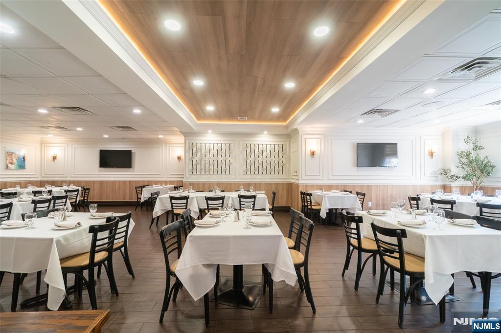 72-74 Elm Road Newark, NJ 07105 - Photo 8 of 41 a view of a dining area with furniture and wooden floor