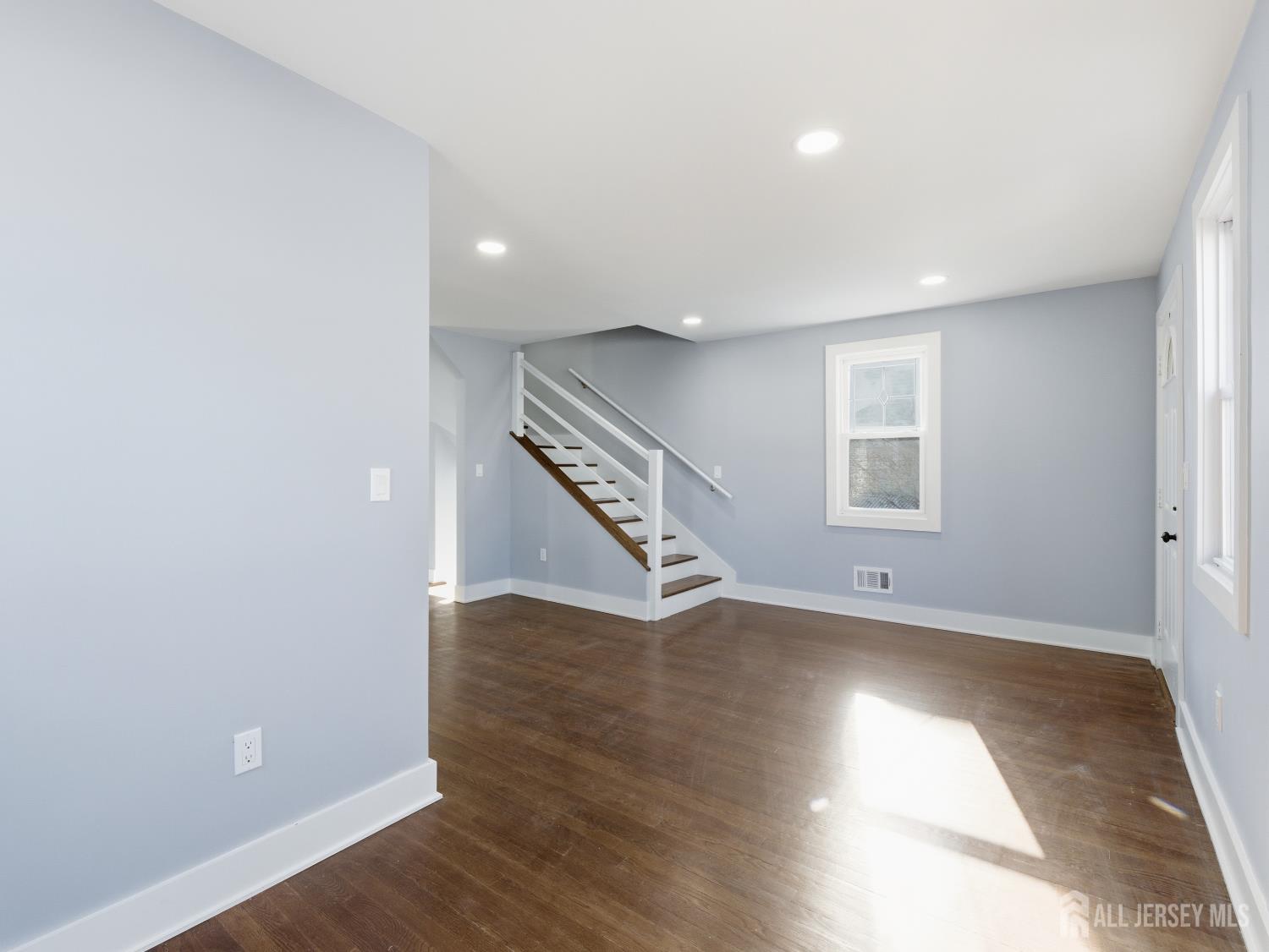 14 John Street Carteret, NJ 07008 - Photo 7 of 33 wooden floor in an empty room with a window