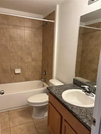 a view of an empty room and wooden floor