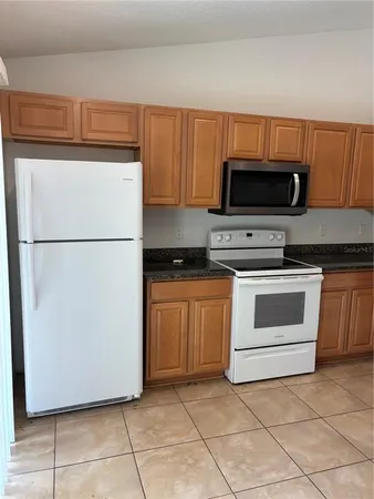 a kitchen with a sink and a stove top oven
