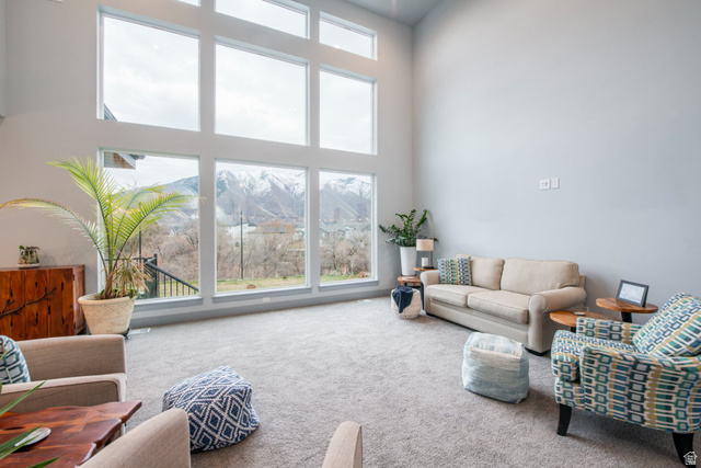 262 North Santa Fe Drive Mapleton, UT 84664 - Photo 11 of 28 Carpeted living room with a high ceiling and healthy amount of natural light