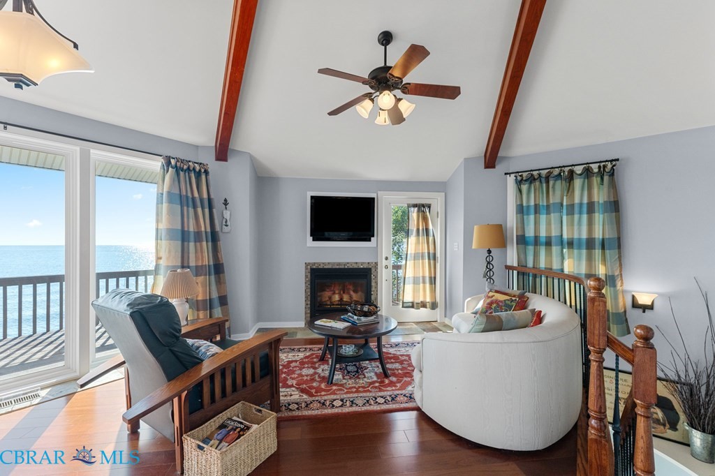 24 River Road Lottsburg, VA 22511 - Photo 21 of 35 a living room with fireplace furniture and a large window