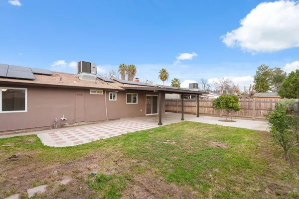 a view of a backyard with a patio