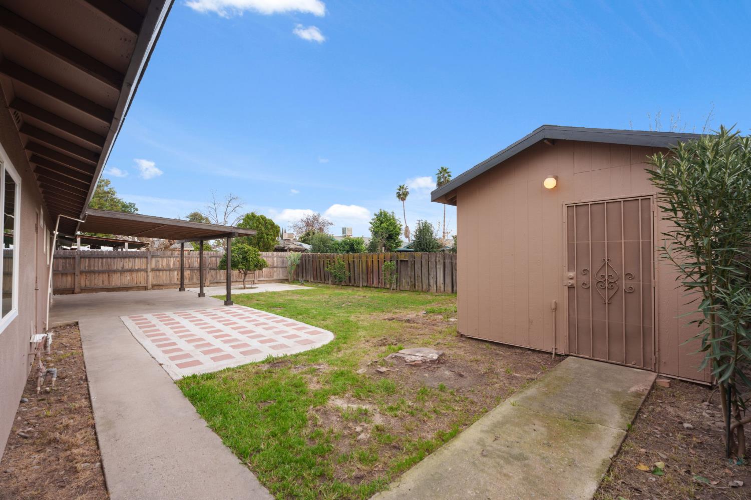 237 East Modoc Avenue Visalia, CA 93291 - Photo 21 of 31 a view of a backyard with a patio