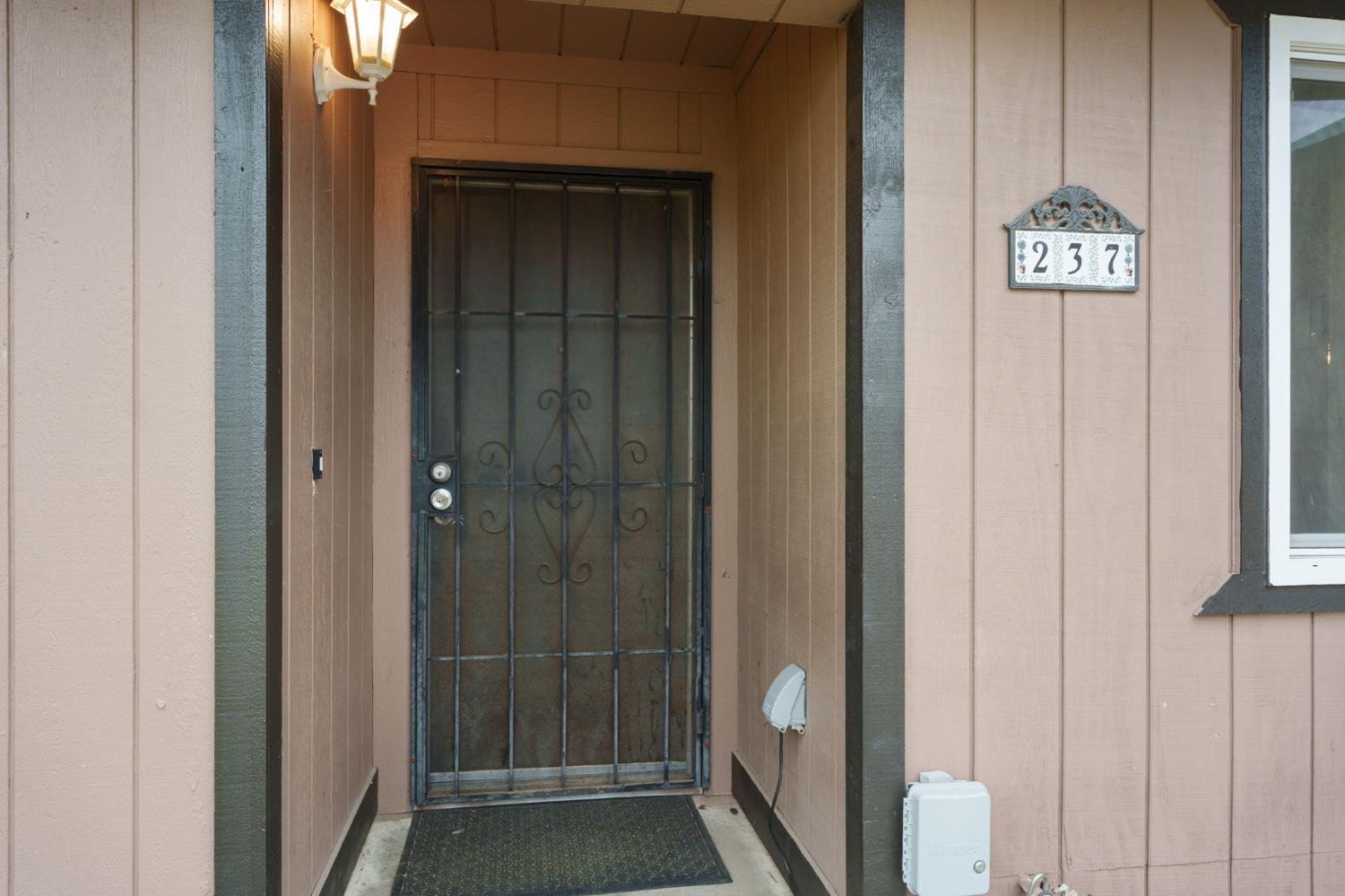 237 East Modoc Avenue Visalia, CA 93291 - Photo 22 of 31 a view of a hallway with wooden floor