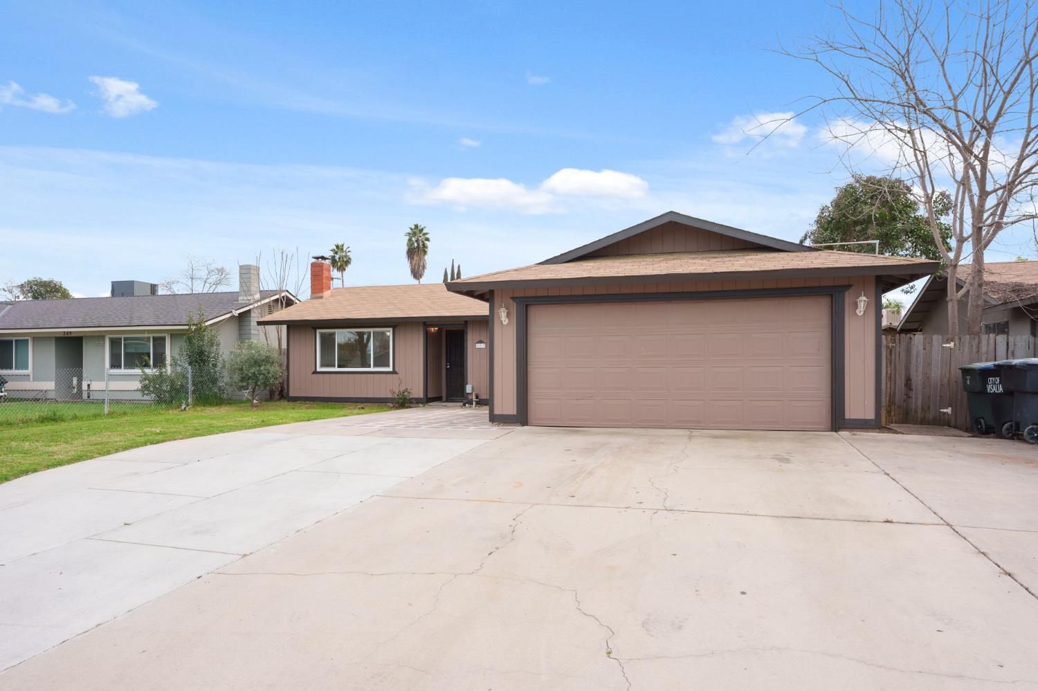 237 East Modoc Avenue Visalia, CA 93291 - Photo 24 of 31 a front view of a house with a garden