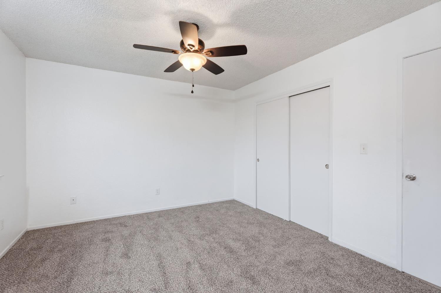 237 East Modoc Avenue Visalia, CA 93291 - Photo 8 of 31 a view of a room with a ceiling fan