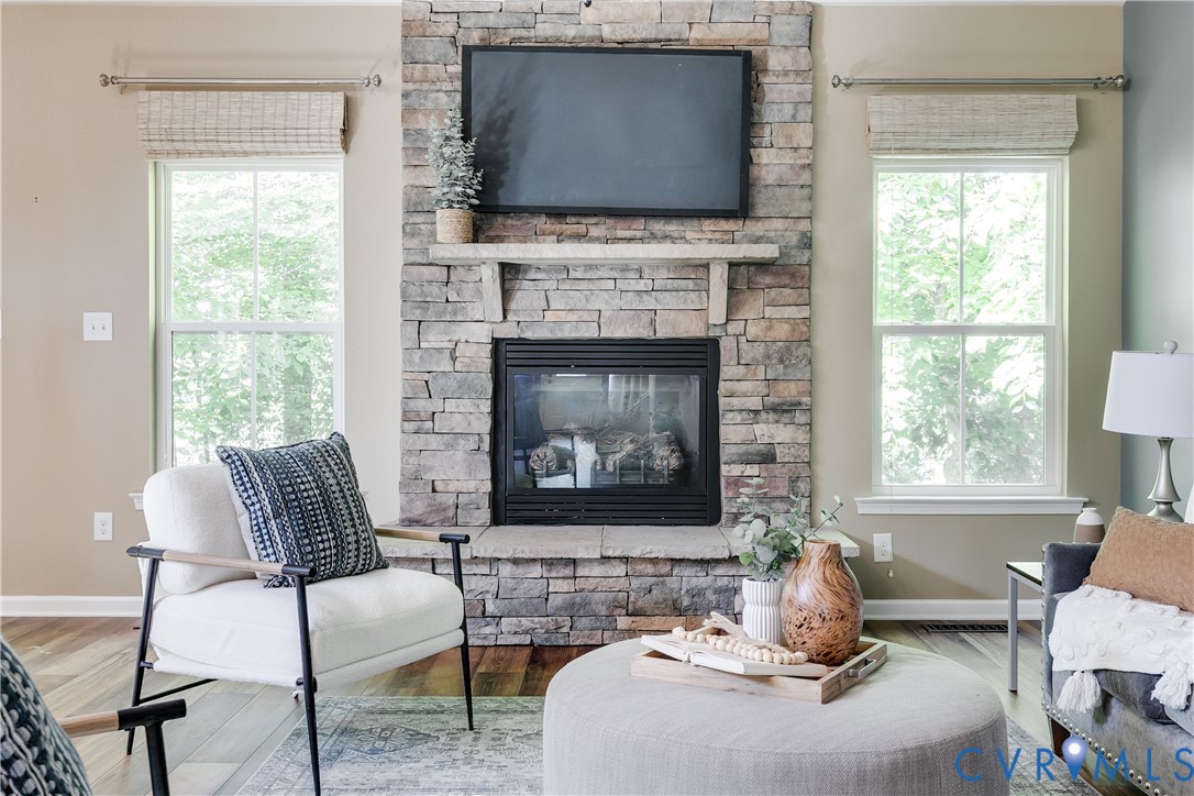 7538 South Franklins Way Quinton, VA 23141 - Photo 15 of 48 a living room with furniture a flat screen tv and a fireplace