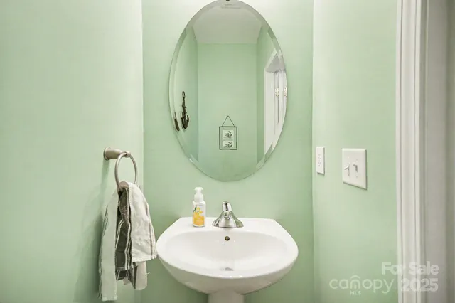 a bathroom with a sink and mirror