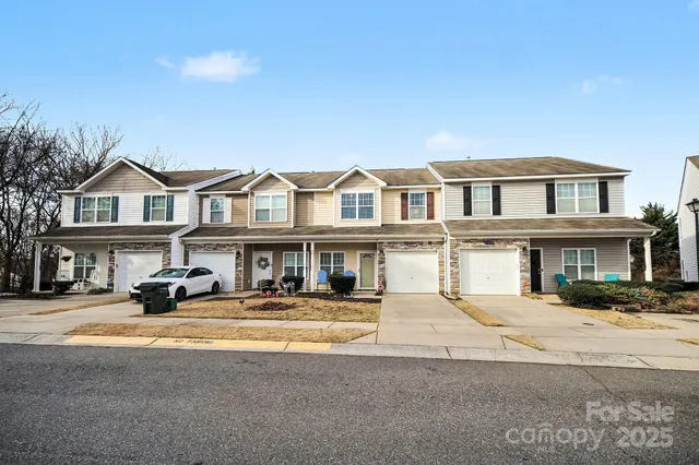 a front view of a house with a street