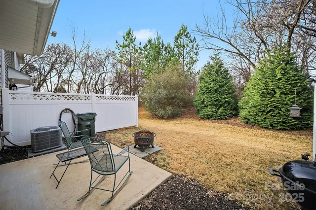 a view of a chairs and table in the patio