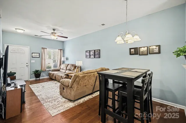 a living room with furniture and a table