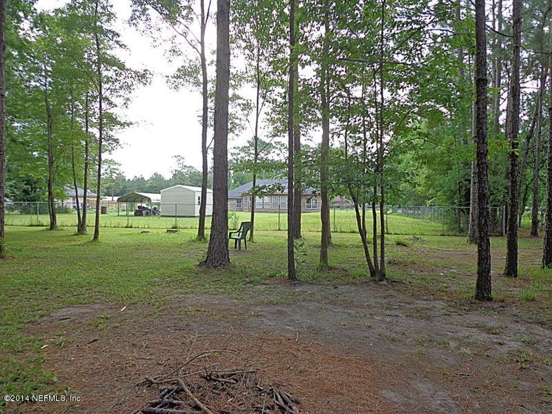 54399 Church Road Callahan, FL 32011 - Photo 15 of 49 a view of a park that has large trees