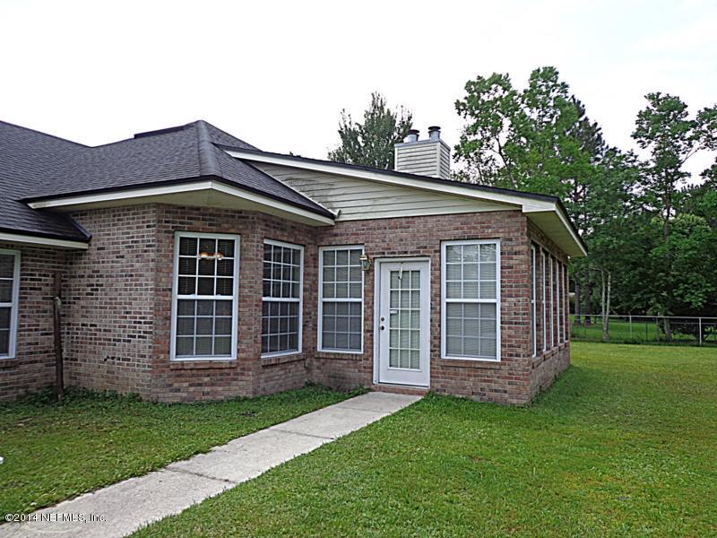54399 Church Road Callahan, FL 32011 - Photo 19 of 49 front view of a house with a yard