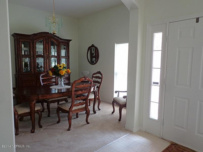54399 Church Road Callahan, FL 32011 - Photo 22 of 49 a view of a dining room with furniture and window