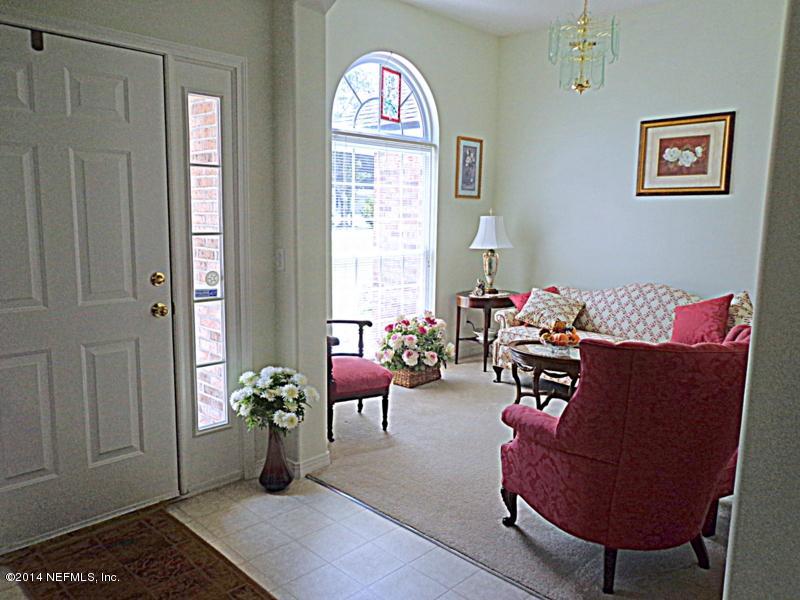 54399 Church Road Callahan, FL 32011 - Photo 23 of 49 a living room with furniture and a window