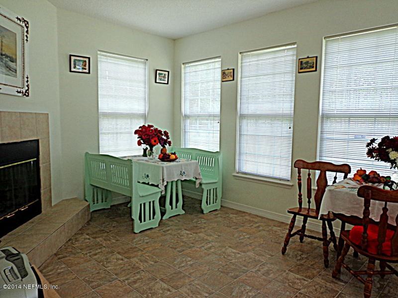 54399 Church Road Callahan, FL 32011 - Photo 35 of 49 a living room with furniture and a fireplace