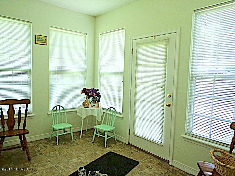 54399 Church Road Callahan, FL 32011 - Photo 36 of 49 a view of a dining room with furniture and a window