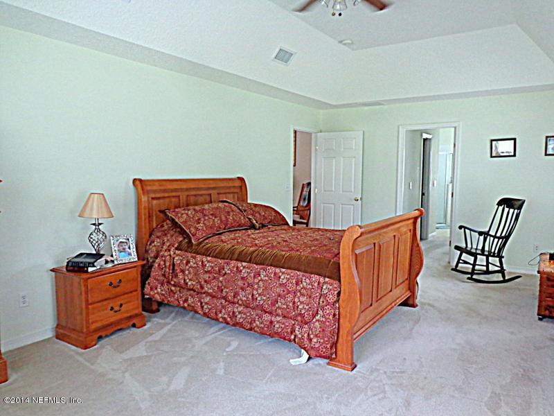 54399 Church Road Callahan, FL 32011 - Photo 37 of 49 a bedroom with a bed and window