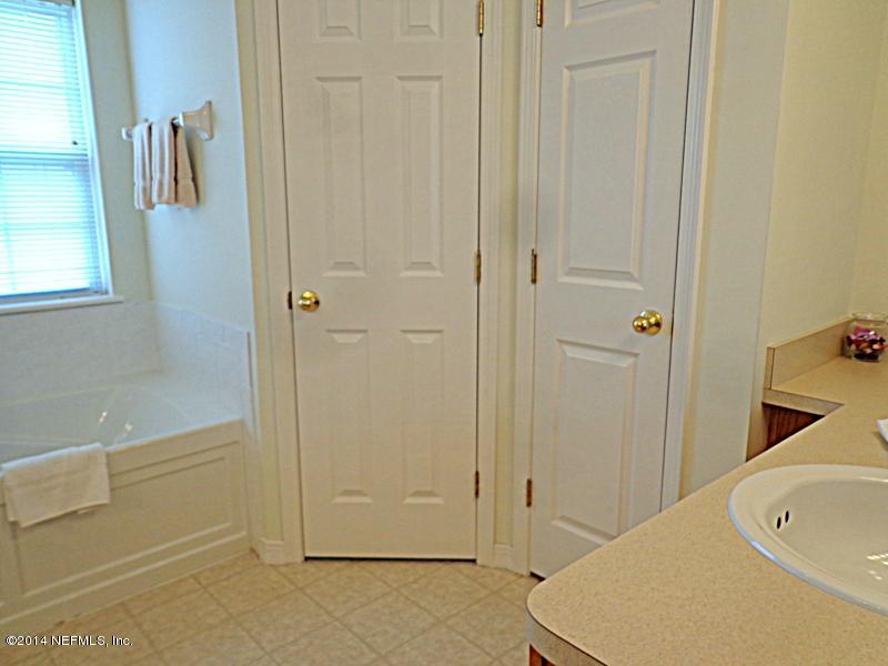 54399 Church Road Callahan, FL 32011 - Photo 41 of 49 a bathroom with a bathtub and a shower
