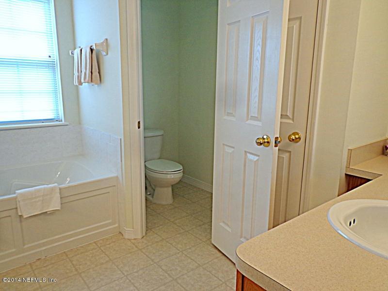 54399 Church Road Callahan, FL 32011 - Photo 42 of 49 a bathroom with a shower and a toilet