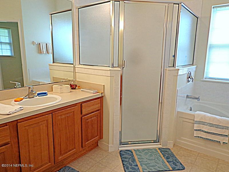 54399 Church Road Callahan, FL 32011 - Photo 43 of 49 a bathroom with a sink and a mirror