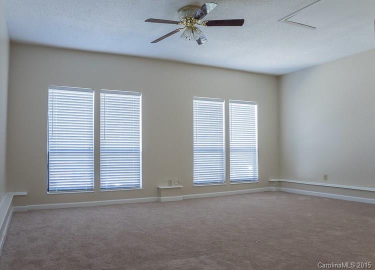 9712 Fairway Ridge Road Charlotte, NC 28277 - Photo 8 of 12 an empty room with windows