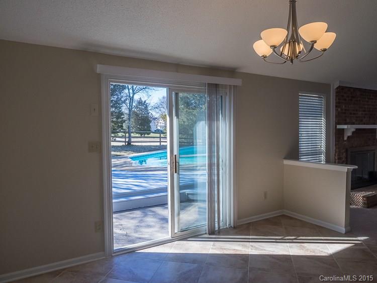 9712 Fairway Ridge Road Charlotte, NC 28277 - Photo 9 of 12 a view of a livingroom with wooden floor and a window