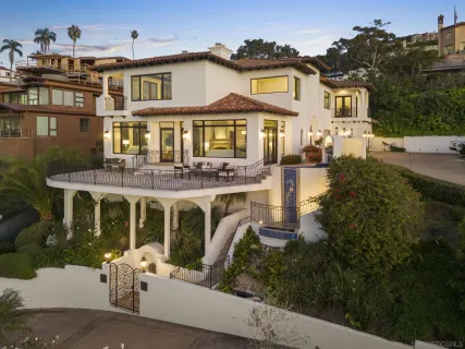 a front view of a residential apartment building with a yard
