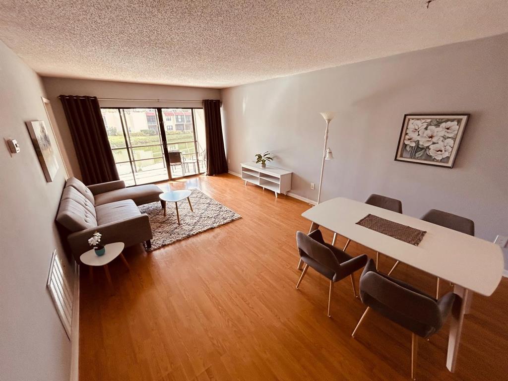2050 Oleander Boulevard, Unit 703 Fort Pierce, FL 34950 - Photo 12 of 25 a living room with furniture and a window