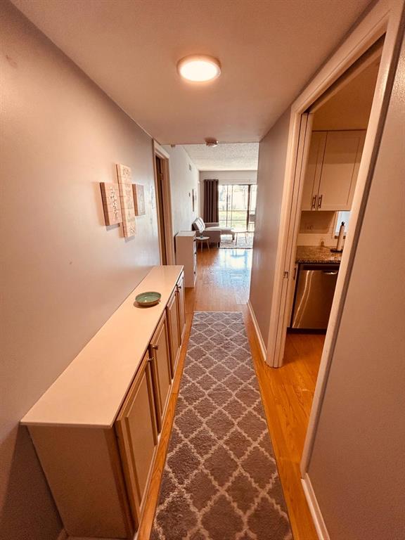 2050 Oleander Boulevard, Unit 703 Fort Pierce, FL 34950 - Photo 2 of 25 a hallway with furniture and a fireplace