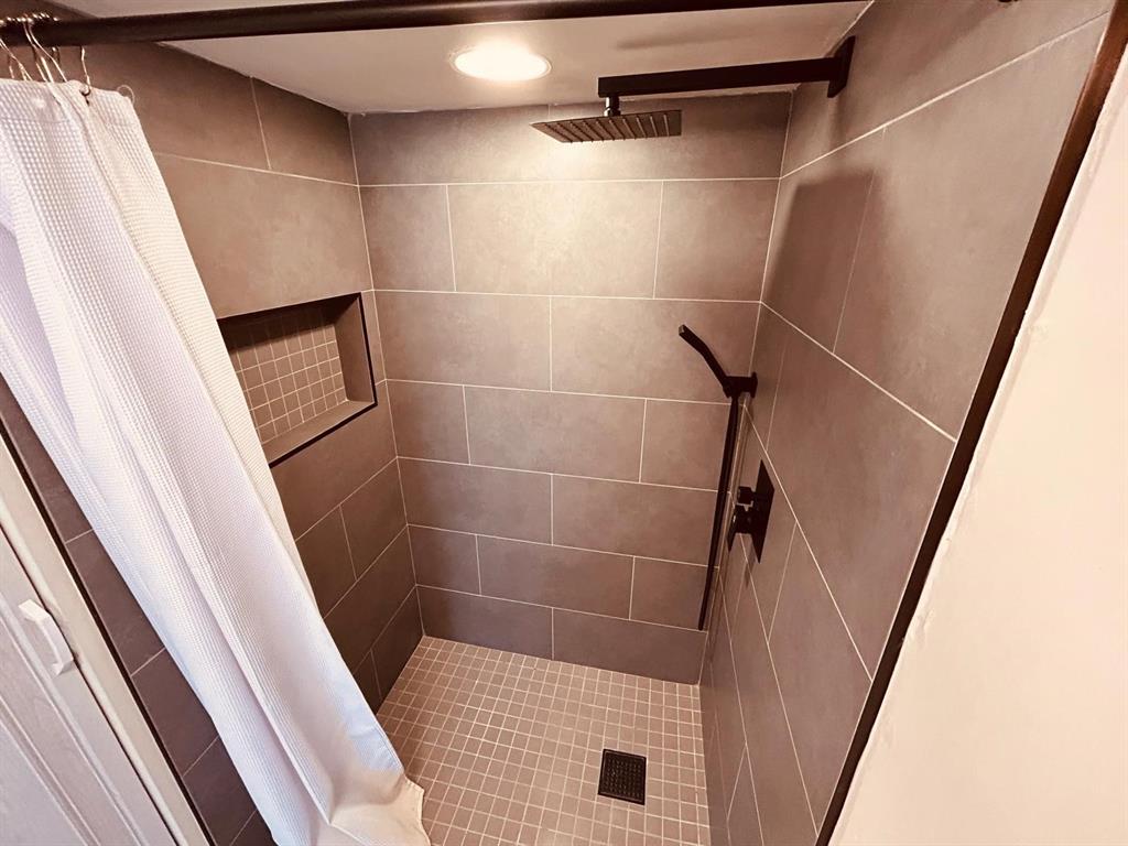 2050 Oleander Boulevard, Unit 703 Fort Pierce, FL 34950 - Photo 23 of 25 a bathroom with a shower