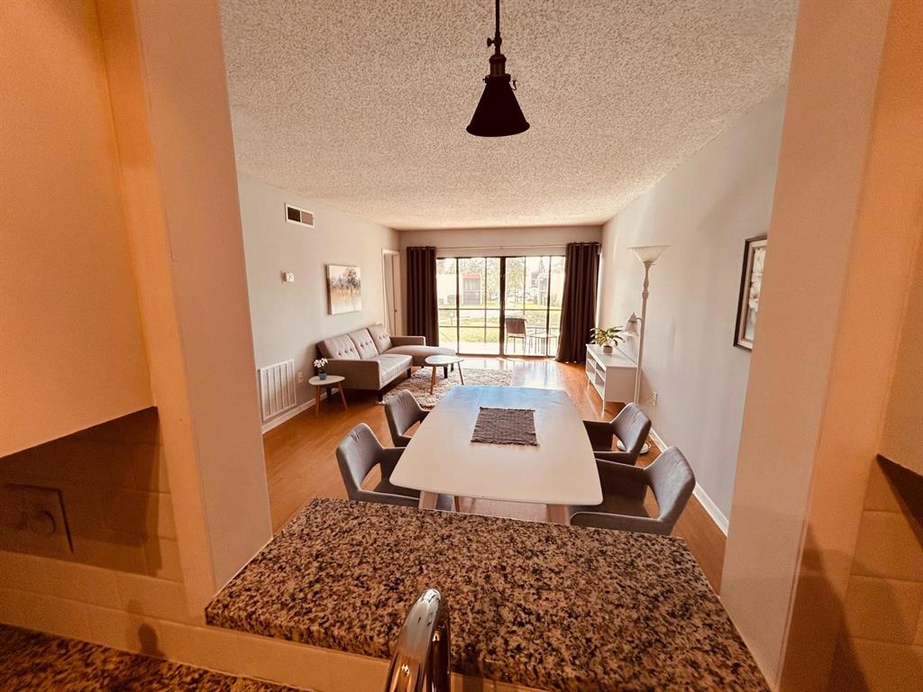 2050 Oleander Boulevard, Unit 703 Fort Pierce, FL 34950 - Photo 8 of 25 a living room with furniture rug and a window