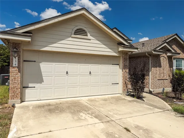 a front view of a house with a garage