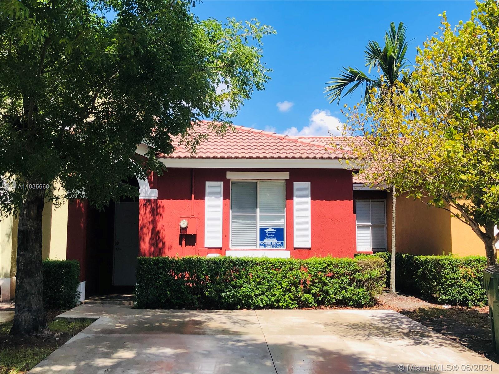 25 Southwest 15th Road, Unit 25 Homestead, FL 33030 - Photo 1 of 15 a front view of a house with a yard