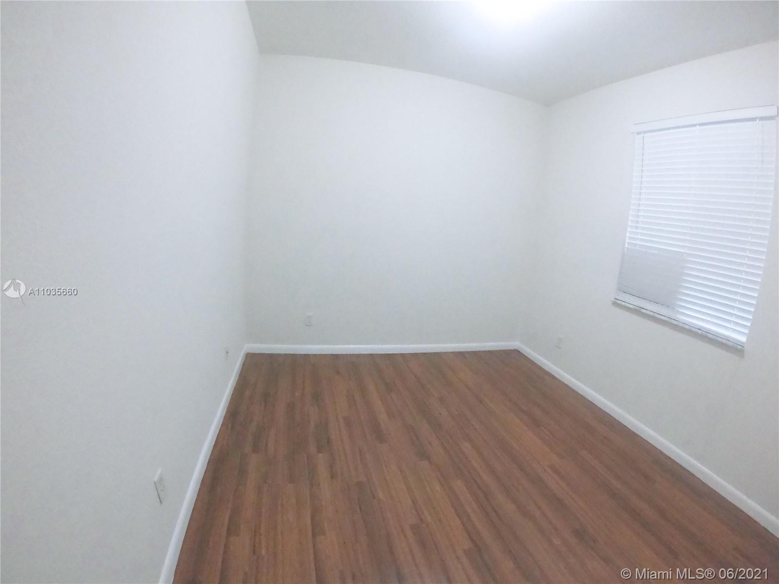 25 Southwest 15th Road, Unit 25 Homestead, FL 33030 - Photo 14 of 15 a view of wooden floor in a room