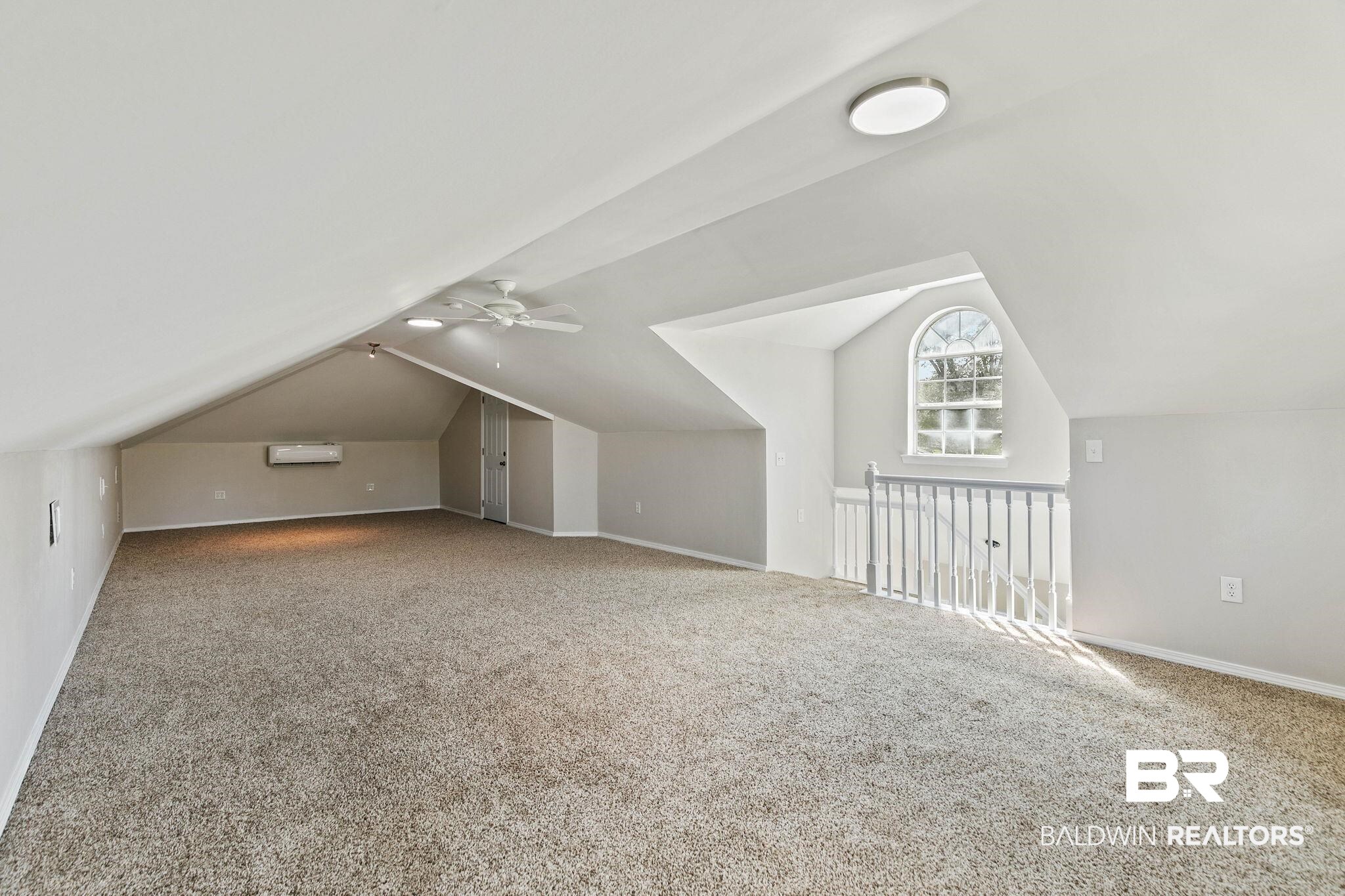 35650 Spring Road North Stapleton, AL 36578 - Photo 51 of 70 Additional living space with lofted ceiling, carpet, ceiling fan, and a wall mounted AC