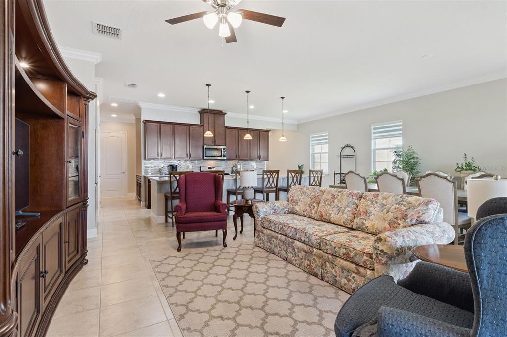 2665 Meadowedge Loop St. Cloud, FL 34772 - Photo 32 of 53 a living room with furniture and a flat screen tv