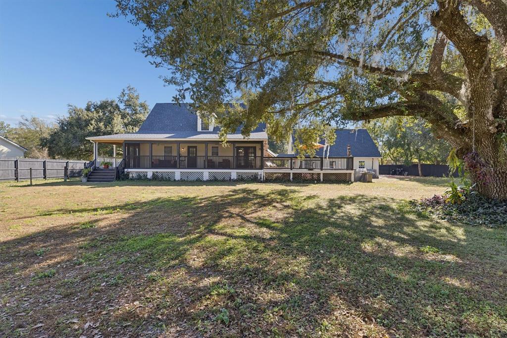 16607 Bearle Road Orlando, FL 32828 - Photo 14 of 57 a view of a house with a yard
