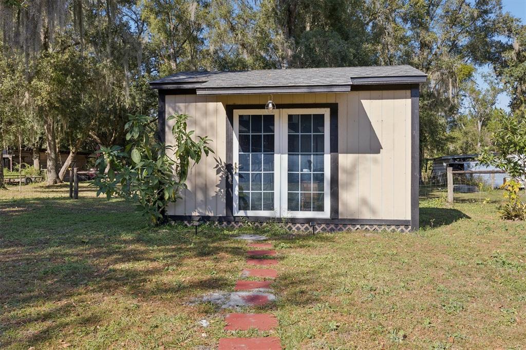 16607 Bearle Road Orlando, FL 32828 - Photo 18 of 57 a view of a house with a yard