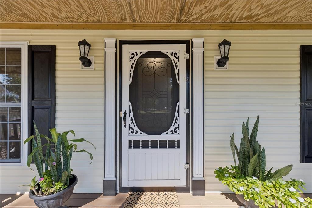 16607 Bearle Road Orlando, FL 32828 - Photo 25 of 57 a view of a entryway door of the house