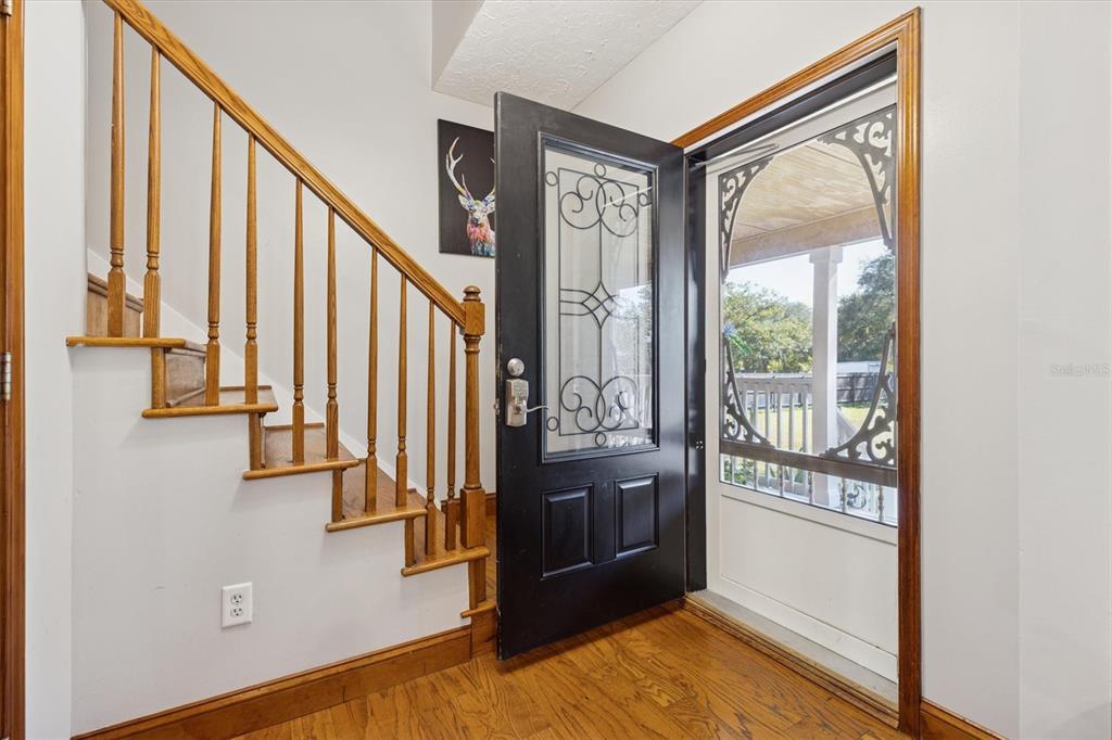 16607 Bearle Road Orlando, FL 32828 - Photo 26 of 57 a view of an entryway with staircase